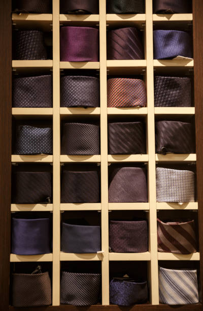 istock Young man in suit in wardrobe 678665544