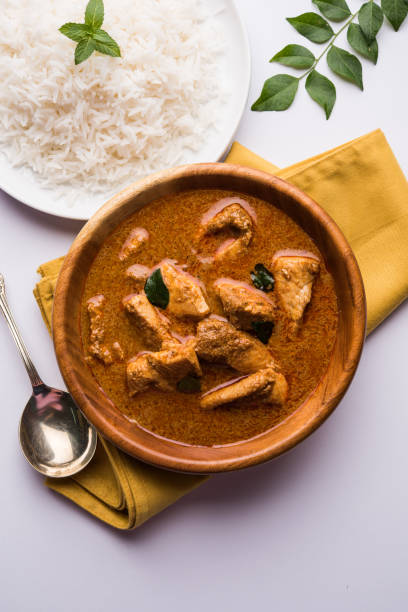istock tasty fish curry served with white cooked basmati rice with curry leaves in the background, favourite coastal indian food 678675434
