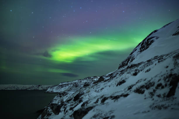 istock Northern lights. Aurora borealis nature landscape at night 678675528