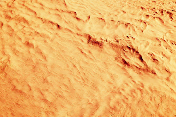 istock Red-yellow bloody desert texture and background. Natural patterns on the sand 678681168