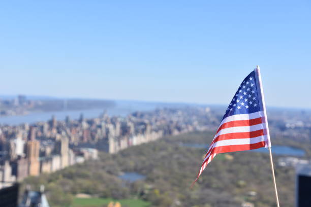 istock US flag against the background of Central Park 678694552