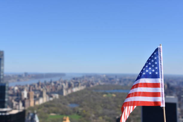 istock US flag against the background of Central Park 678695284