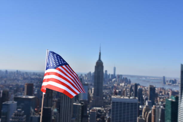 istock US flag against the background of Empire State Building 678698542