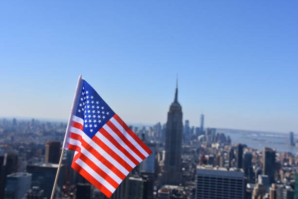 istock US flag against the background of Empire State Building 678698876