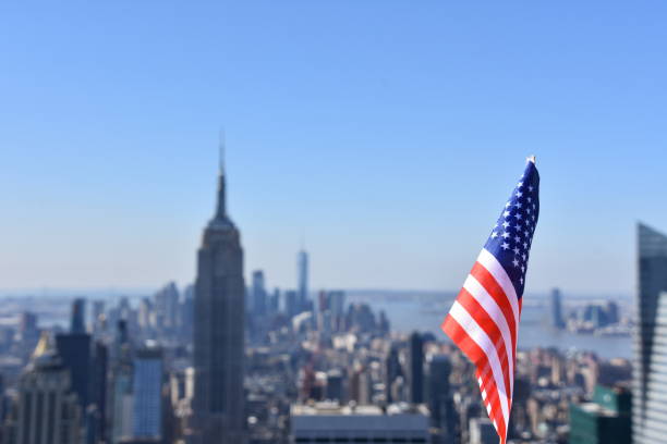 istock US flag against the background of Empire State Building 678699346