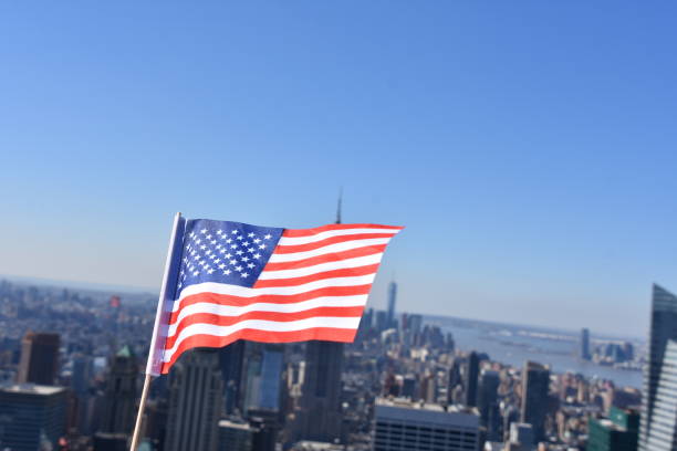 istock US flag against the background of Empire State Building 678699348