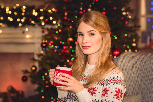 istock Woman holding cup with hot drink 678700272