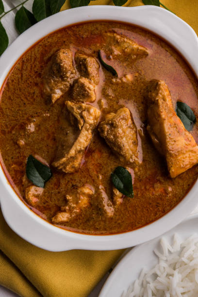 istock tasty fish curry served with white cooked basmati rice with curry leaves in the background, favourite coastal indian food 678701938