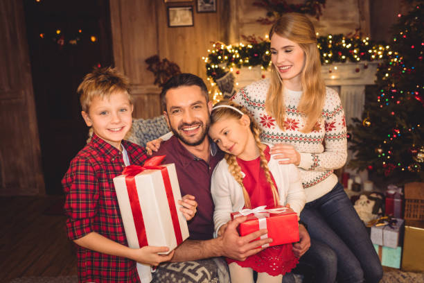 istock Happy family with christmas presents 678702008
