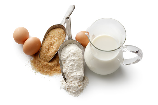Baking: Sugar, Flour, Milk and Eggs Isolated on White Background