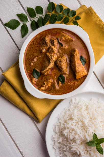 istock tasty fish curry served with white cooked basmati rice with curry leaves in the background, favourite coastal indian food 678702834
