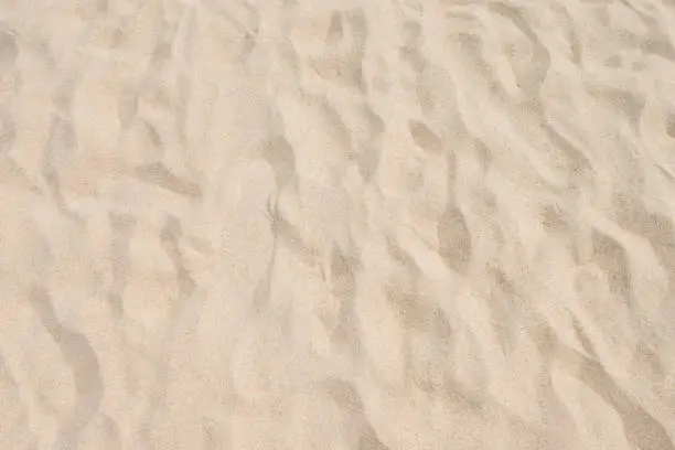 Photo of closeup of sand pattern of a beach in the summer