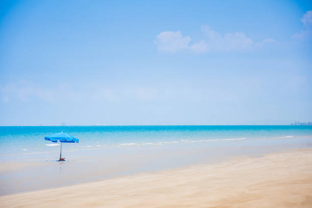 istock umbrella on the beach blue sea summer vacation 678722920