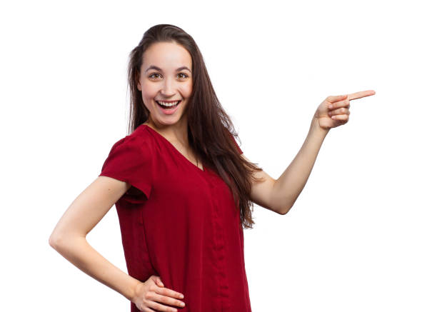 istock Cheerful woman pointing 678724070