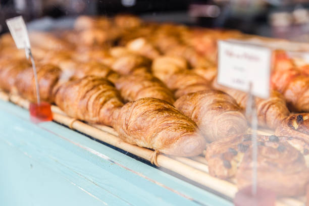 Freshly baked sweet croissants in a bakery