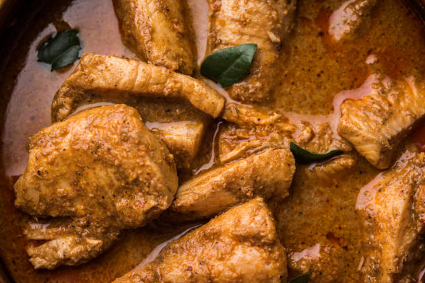 istock tasty fish curry served with white cooked basmati rice with curry leaves in the background, favourite coastal indian food 678728932