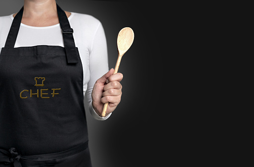 empty template cook holding wooden spoon background concept.