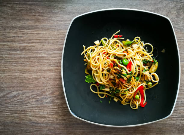 istock Stir fried spicy spaghetti with seafood thai style pasta 678735958