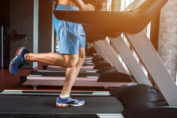 istock Legs running on the treadmill close up 678743102