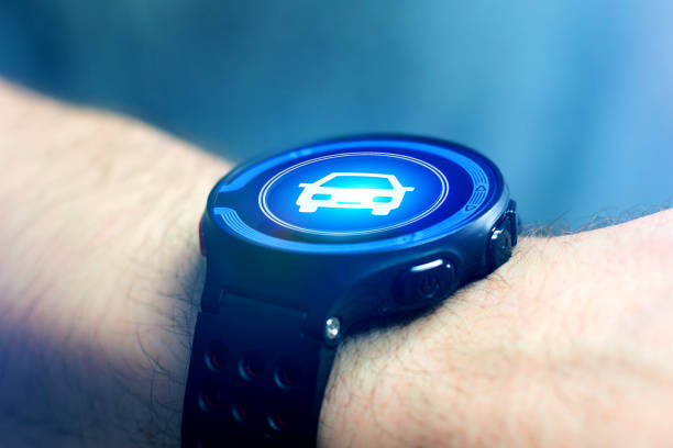 istock Businessman hand holding smartwatch with car icon 678744302