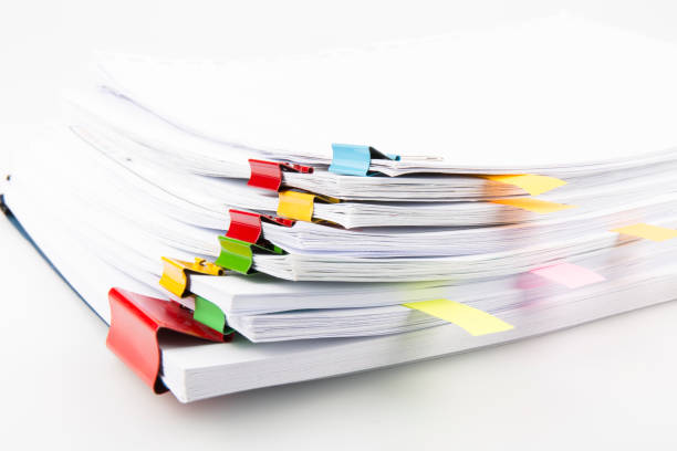 Pile of documents with colorful clips high angle view clip stock pictures, royalty-free photos & images