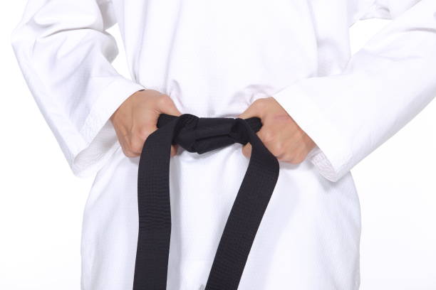 istock Master Black Belt TaeKwonDo Teacher hold  and tie belt pose 678744906