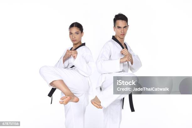 Two Man And Woman Master Black Belt Taekwondo Teacher Show Fighting Session Kick And Pounch Stock Photo - Download Image Now