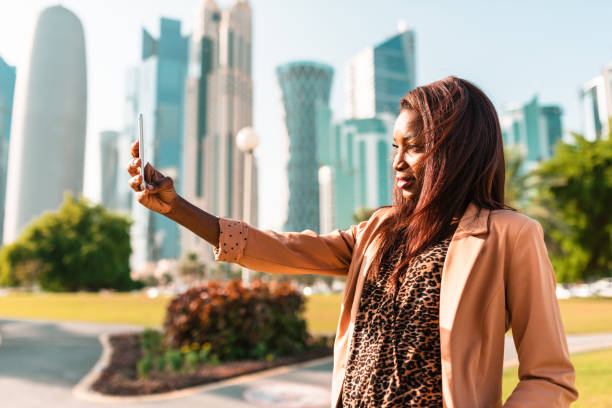 istock tourist take a selfie in doha park 678751178