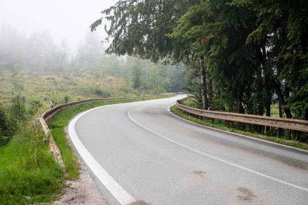 istock mountain country road in summer 678752070