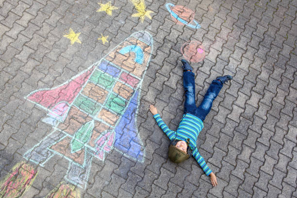 istock little kid boy flying by a space shuttle chalks picture 678753688