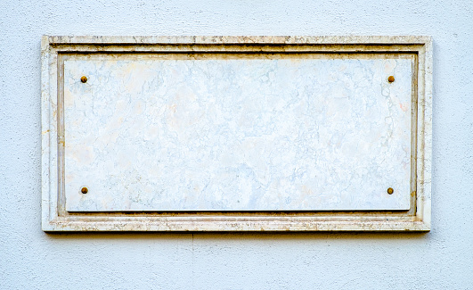 old blank sign at a wall