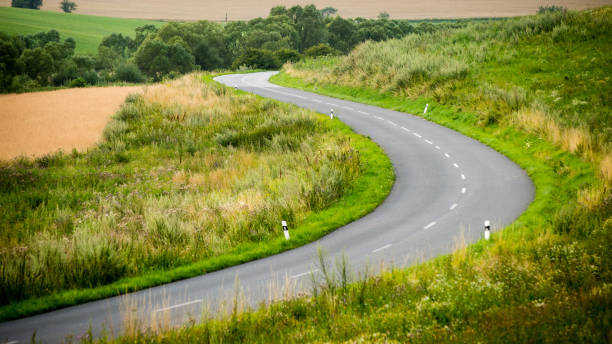 istock mountain country road in summer 678772088