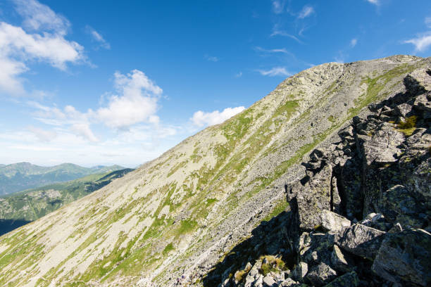 istock rocky mountain landscape covered with clouds 678774238
