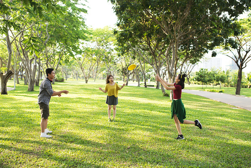 Child throwing a frisbee at the public park