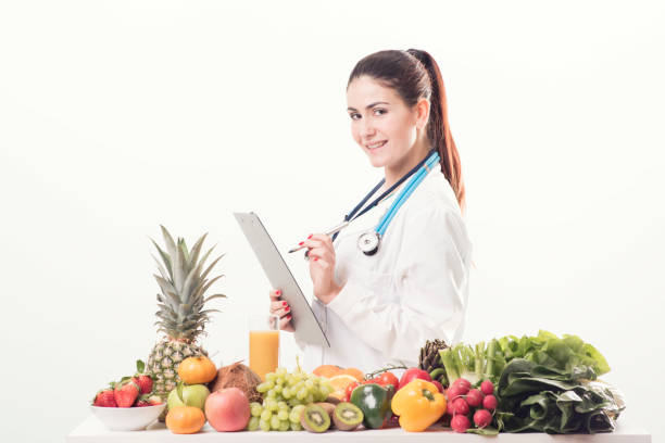istock Female dietitian in uniform with stethoscope 678775618