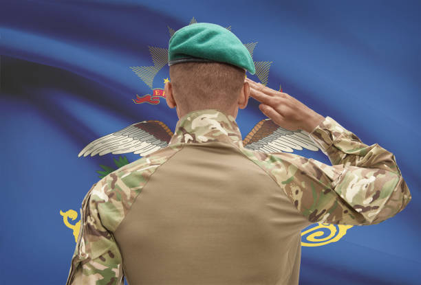 istock Dark-skinned soldier with US state flag on background - North Dakota 678781258