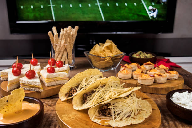 istock Game Day Snacks / Table with tacos, sandwiches and snacks 678781358