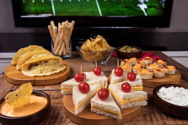istock Game Day Snacks / Table with tacos, sandwiches and snacks 678781450