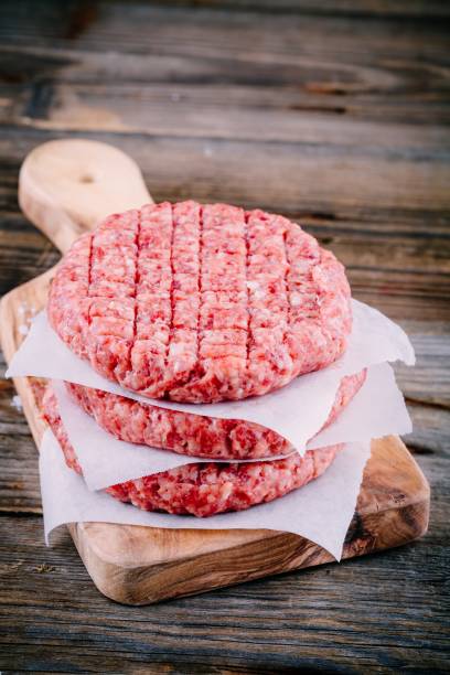 istock Ingredients for burgers: raw minced beef cutlets 678781502