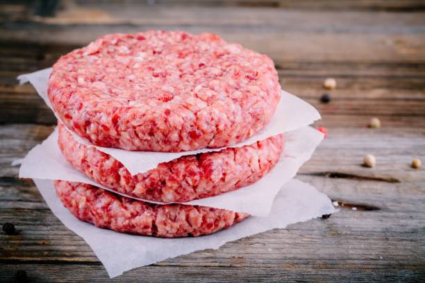 istock Ingredients for burgers: raw minced beef cutlets 678781534