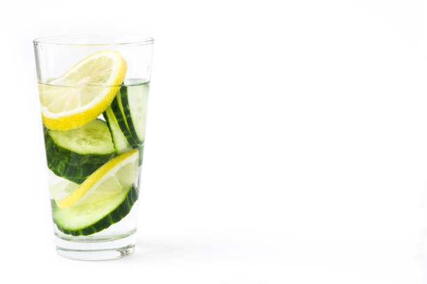 Detox water with cucumber and lemon isolated on white background