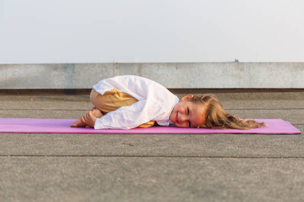 istock Baby doing yoga on the roof 678786590