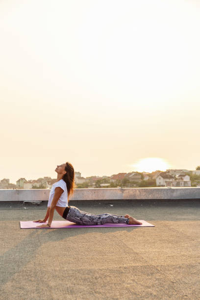 istock Young woman practicing yoga 678790066