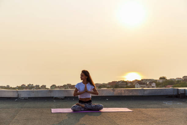 istock Young woman practicing yoga 678790308