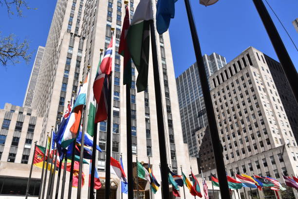 istock Skyscraper with world flags at the entrance 678790692