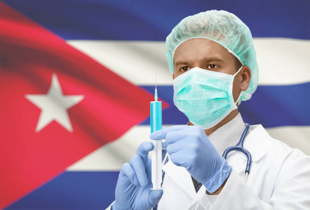 Doctor with syringe in hands and flag on background series - Cuba stock photo