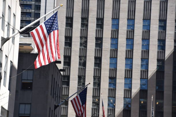 istock Skyscraper with US flag at the entrance 678795480