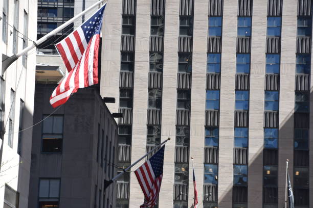 istock Skyscraper with US flag at the entrance 678795482