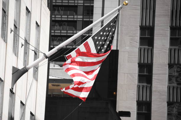 istock Skyscraper with US flag at the entrance 678796288