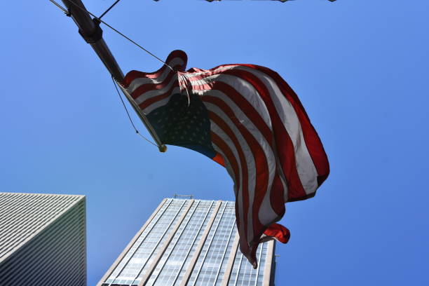 istock Skyscraper with US flag at the entrance 678797880